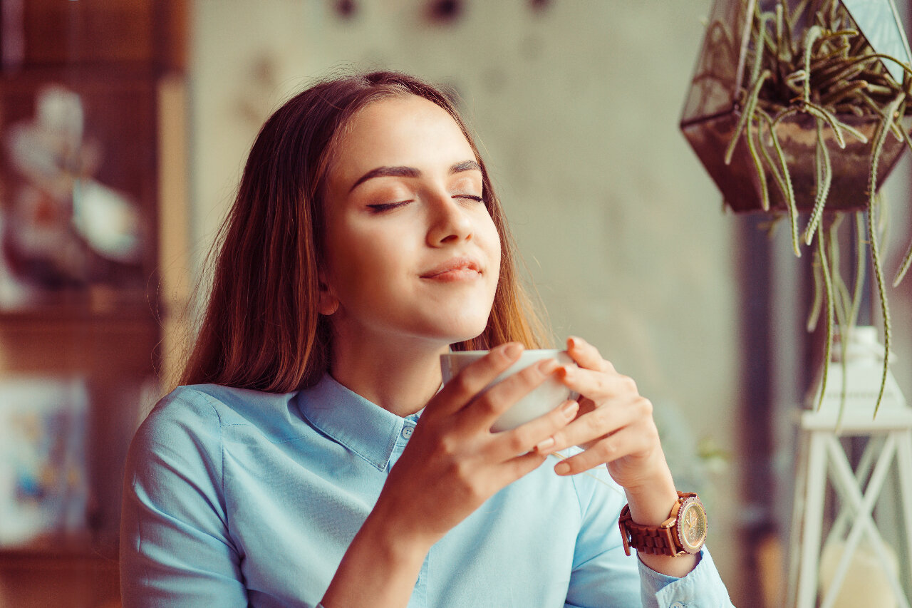 Woman enjoying a moment alone at a restaurant Woman enjoying a moment alone at a restaurant
